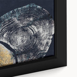 Close-up of a framed abstract wall art piece showcasing vibrant strokes and lines in shades of blue, orange, and yellow, perfect for modern home decor accents.