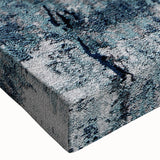 Close-up of an abstract strokes and lines design stretched canvas wall art, showcasing vibrant colors of blue and gold with a textured finish, perfect for modern decor.