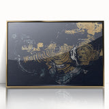 Framed abstract wall art featuring dynamic gold strokes and lines on a sleek acrylic surface, ideal for modern decor and enhancing interior aesthetics.