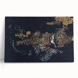 Abstract wall art featuring vibrant strokes and lines in shades of blue, orange, and yellow, printed on stretched canvas, leaning against a neutral backdrop. Perfect for modern home decor to add a splash of color and creativity.