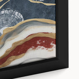 Close-up of a framed canvas artwork showcasing an abstract design with vibrant strokes and lines in shades of blue, orange, and yellow, perfect for modern decor.