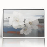 Framed wall art featuring an abstract design of colorful strokes and lines, set against a white background, adding a modern touch to interior decor.