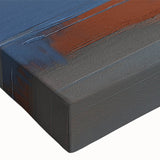 Abstract canvas wall art showcasing vibrant strokes and lines in a dynamic color palette of blue, orange, and gold, ideal for modern home decor.