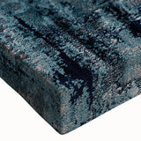 Close-up of a stretched canvas featuring an abstract design with vibrant strokes and lines in shades of blue, yellow, and red, ideal for contemporary home decor.