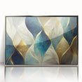 Framed wall art featuring an abstract design with vibrant strokes and lines in silver and shades of blue, perfect for modern decor.