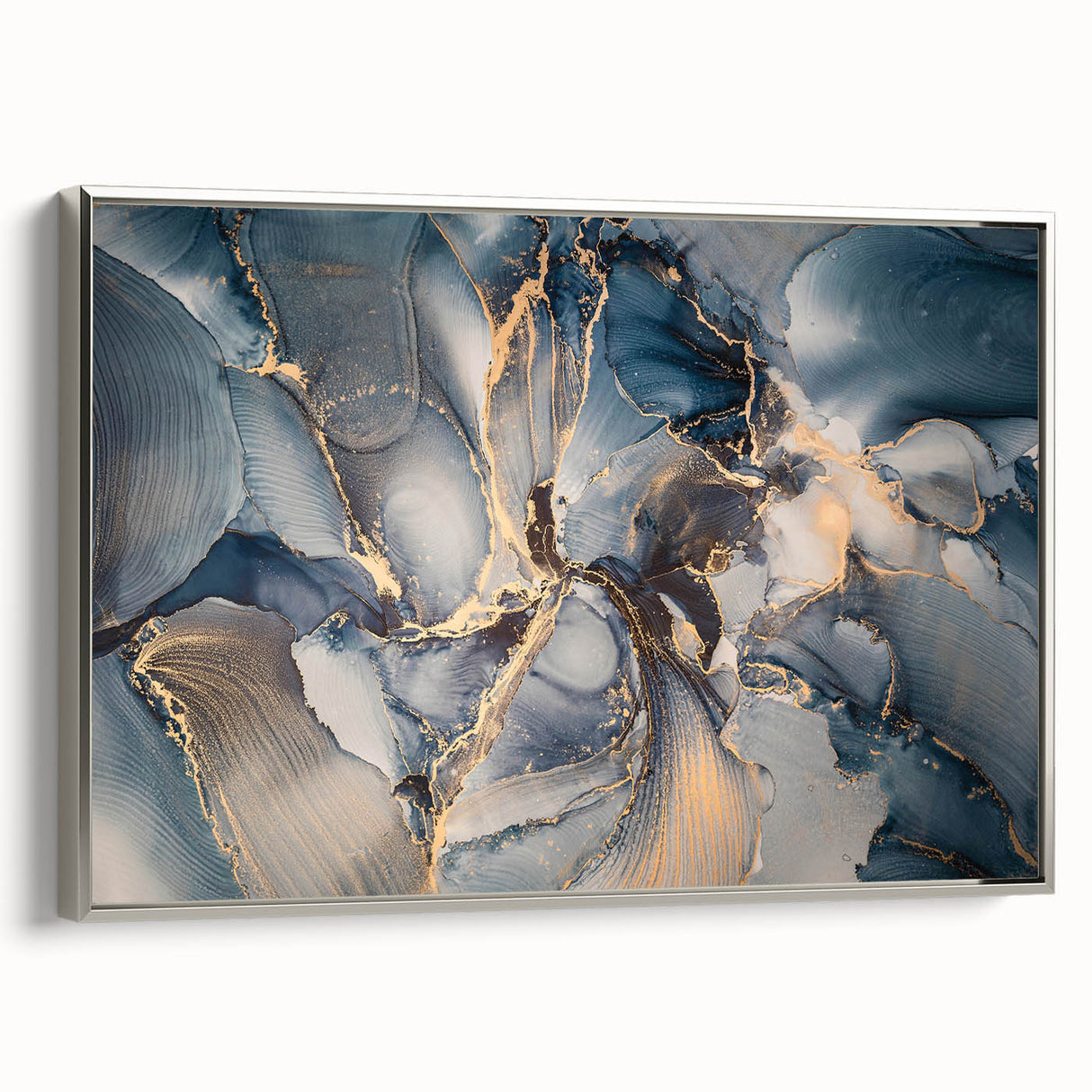 Framed abstract wall art showcasing dynamic strokes and lines in silver tones, adding a modern touch to home decor.
