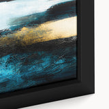 Close-up of a framed abstract wall art piece showcasing vibrant strokes and lines in shades of blue, yellow, and red, perfect for modern decor.
