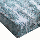 Close-up view of a vibrant abstract wall art piece featuring dynamic strokes and lines in shades of blue, orange, and white, ideal for modern decor. This stretched canvas showcases a contemporary design, making it a striking addition to any interior space.