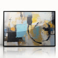 Framed abstract wall art featuring vibrant strokes and lines in black, orange, and blue, perfect for modern home decor.
