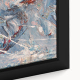 Close-up of abstract wall art featuring vibrant strokes and lines in blue, orange, and yellow, framed for a contemporary decor style.