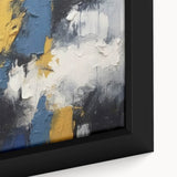 Close-up of framed abstract wall art showcasing vibrant strokes and lines in blue, orange, and yellow, perfect for modern decor.