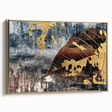 Framed canvas wall art showcasing an abstract design with gold strokes and lines, presented in a sleek, modern frame, ideal for contemporary home decor.