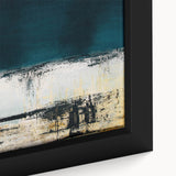 Close-up of a framed abstract wall art piece featuring vibrant strokes and lines in bold colors, enhancing modern interior decor.