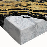 Close-up of a stretched canvas featuring an abstract design with vibrant strokes and lines in shades of blue, orange, and yellow, ideal for modern home decor.