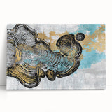 Abstract wall art featuring vibrant strokes and lines in shades of blue, orange, and yellow. The stretched canvas leans against a neutral wall, adding a modern touch to home decor.