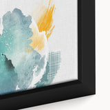 Close-up of framed wall art featuring an abstract design of colorful strokes and lines, showcasing vibrant hues of blue, orange, and yellow, perfect for modern decor.