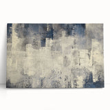 Abstract wall art featuring vibrant strokes and lines in shades of blue, orange, and yellow, elegantly stretched on canvas and leaning against a neutral wall, perfect for modern home decor.