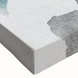 Close-up of a modern abstract wall art design featuring vibrant strokes and lines in shades of blue, orange, and yellow on stretched canvas, perfect for contemporary decor.