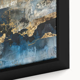 Close-up of a framed canvas wall art piece showcasing an abstract design with vibrant strokes and lines in shades of blue, orange, and yellow, perfect for modern decor.