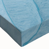 Close-up of an abstract wall art design featuring vibrant strokes and lines in shades of blue, orange, and green, printed on stretched canvas for modern decor.