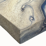 Close-up of an abstract wall art canvas featuring vibrant strokes and lines in shades of blue, yellow, and orange, showcasing a modern artistic design perfect for home decor.