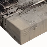 Close-up of an abstract canvas wall art piece featuring vibrant strokes and lines in shades of blue, orange, and yellow, showcasing modern artistic design elements.