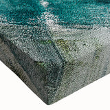 Close-up of an abstract art piece showcasing vibrant strokes and lines in bold colors, printed on stretched canvas designed for modern wall decor.