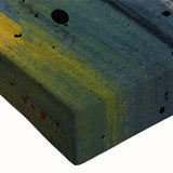 Close-up of abstract canvas wall art featuring vibrant strokes and lines in shades of blue, orange, and yellow, showcasing a modern artistic design perfect for home decor.