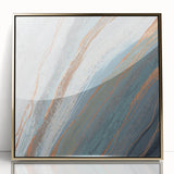 Framed wall art featuring an abstract design of gold strokes and lines on a white background, perfect for modern home decor and artistic interiors.