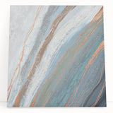 Abstract canvas wall art design featuring vibrant strokes and lines in hues of blue, orange, and yellow, elegantly leaning against a neutral wall, perfect for modern decor.
