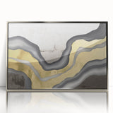 Framed acrylic wall art featuring an abstract design of strokes and lines in shades of silver and white, perfect for modern home decor, enhancing any living space.