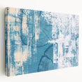 Abstract canvas wall art featuring vibrant strokes and lines in shades of blue, yellow, and gray, showcasing a modern design ideal for contemporary home decor.