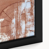 Close-up of a framed canvas artwork showcasing vibrant abstract strokes and lines in shades of blue, orange, and yellow, ideal for modern home decor.