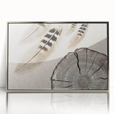 Framed abstract wall art featuring elegant strokes and lines in silver and white tones, designed to enhance modern interiors, displayed in a sleek frame.