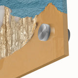 Close-up of an abstract wall art design showcasing vibrant strokes and lines in shades of blue and gold, printed on high-quality acrylic glass, ideal for modern decor.