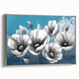 Framed canvas wall art featuring an abstract design of colorful strokes and lines in shades of blue, pink, and gold, with a sleek silver frame, ideal for modern decor.