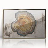 Framed acrylic wall art featuring an abstract design of gold strokes and lines on a white background, perfect for modern home decor and enhancing interior aesthetics.