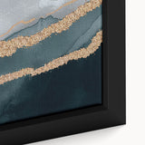 Abstract wall art featuring vibrant strokes and lines in shades of blue, orange, and gray, framed elegantly for modern decor, enhancing any living space.