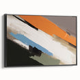 Framed wall art featuring an abstract design of colorful strokes and lines on a black background, showcasing a modern aesthetic for contemporary home decor.