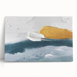 Abstract wall art featuring vibrant strokes and lines in shades of blue, orange, and green, displayed on a stretched canvas, leaning against a neutral wall, perfect for modern home decor.