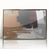 Framed acrylic wall art depicting an abstract design of gold strokes and lines on a white background, ideal for modern home décor.