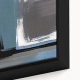 Close-up view of an abstract wall art piece showcasing vibrant strokes and lines in shades of blue, orange, and gold, framed elegantly for modern decor.