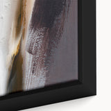 Close-up of a framed canvas artwork showcasing an abstract design with colorful strokes and lines, perfect for modern home decor and artistic expression.