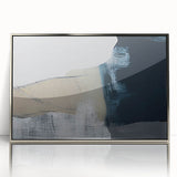 Framed wall art featuring an abstract design of silver strokes and lines against a white background, adding a modern touch to home decor.