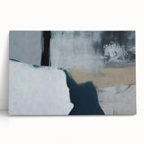 Abstract wall art featuring vibrant strokes and lines in shades of blue, orange, and yellow, showcasing a modern design ideal for home decor. This stretched canvas piece leans against a neutral backdrop, adding a contemporary touch to any space.