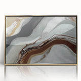 Framed abstract wall art featuring dynamic strokes and lines in gold and black, creating a modern aesthetic ideal for contemporary decor.