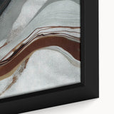 Close-up of a framed canvas artwork featuring abstract strokes and lines in vibrant colors, showcasing modern design elements suitable for contemporary home decor.