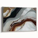 Framed abstract wall art featuring dynamic strokes and lines in shades of gray and silver, perfect for modern home decor, displayed from a side view.