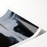 Abstract wall art print showcasing vibrant strokes and lines in a blend of blue, orange, and yellow hues, rolled and ready for display in a stylish setting. Perfect for modern home decor enthusiasts seeking colorful accent pieces.