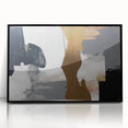 Framed wall art featuring an abstract design with bold strokes and lines in black, showcasing a modern aesthetic ideal for contemporary decor.